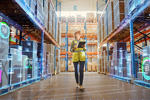 Warehouse manager walking through warehouse